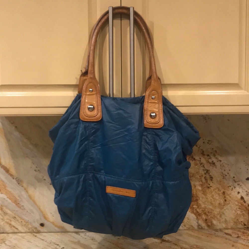 Green Christopher Kon purse.